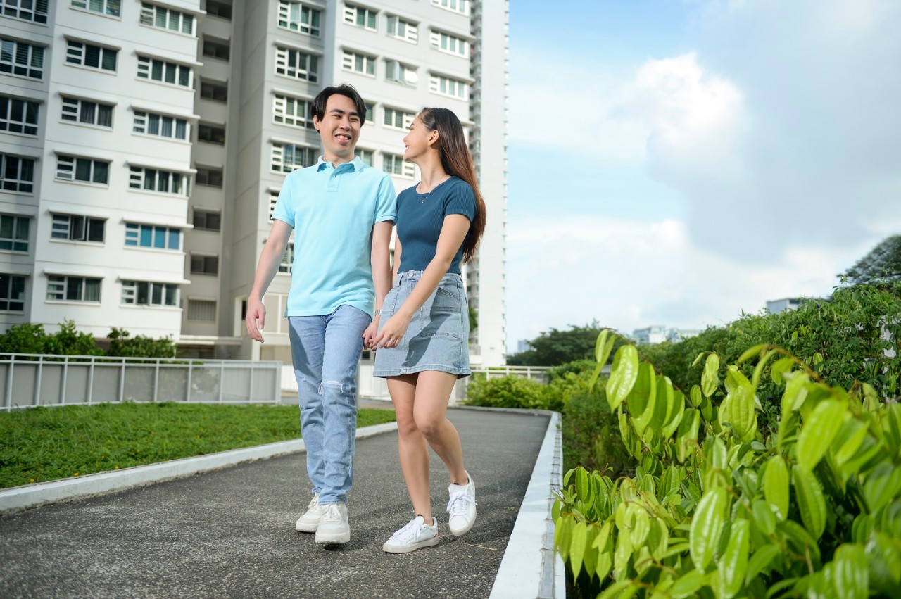 Young couple walking at their HDB estate