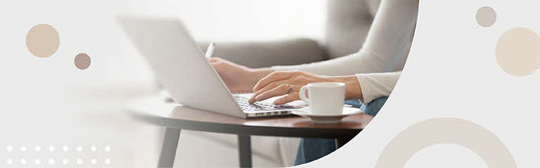 Lady at cafe with laptop and coffee