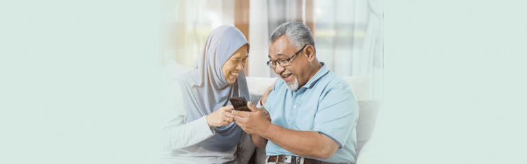 Happy couple looking at phone