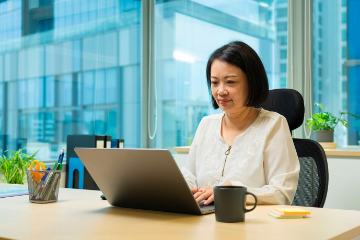 Lady looking at her laptop