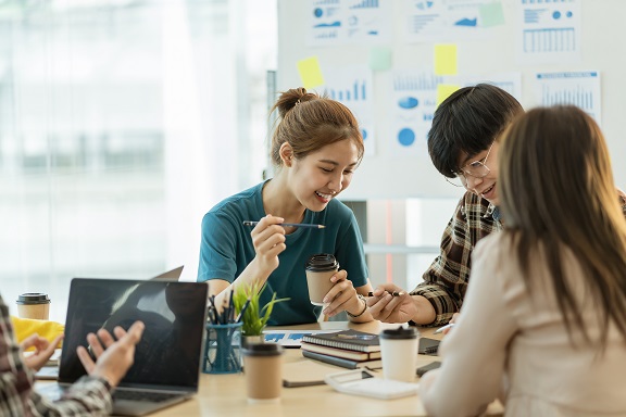 group of young asian colleagues working together