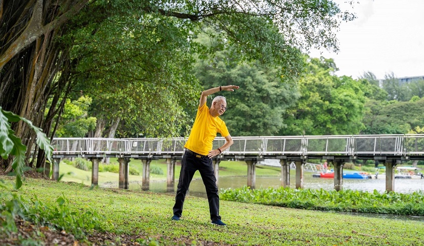 Elderly man exercising in the park