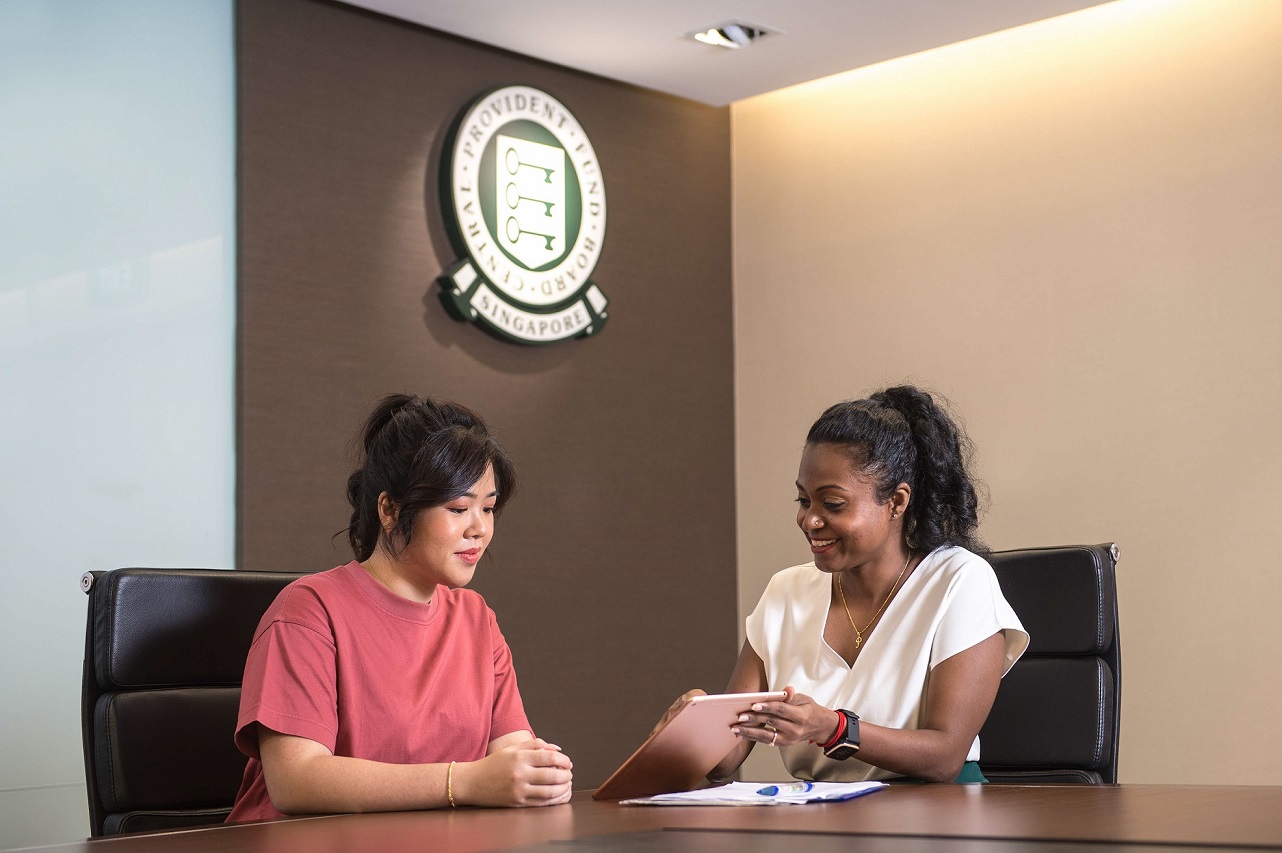 Chinese and Indian lady discussing over documents