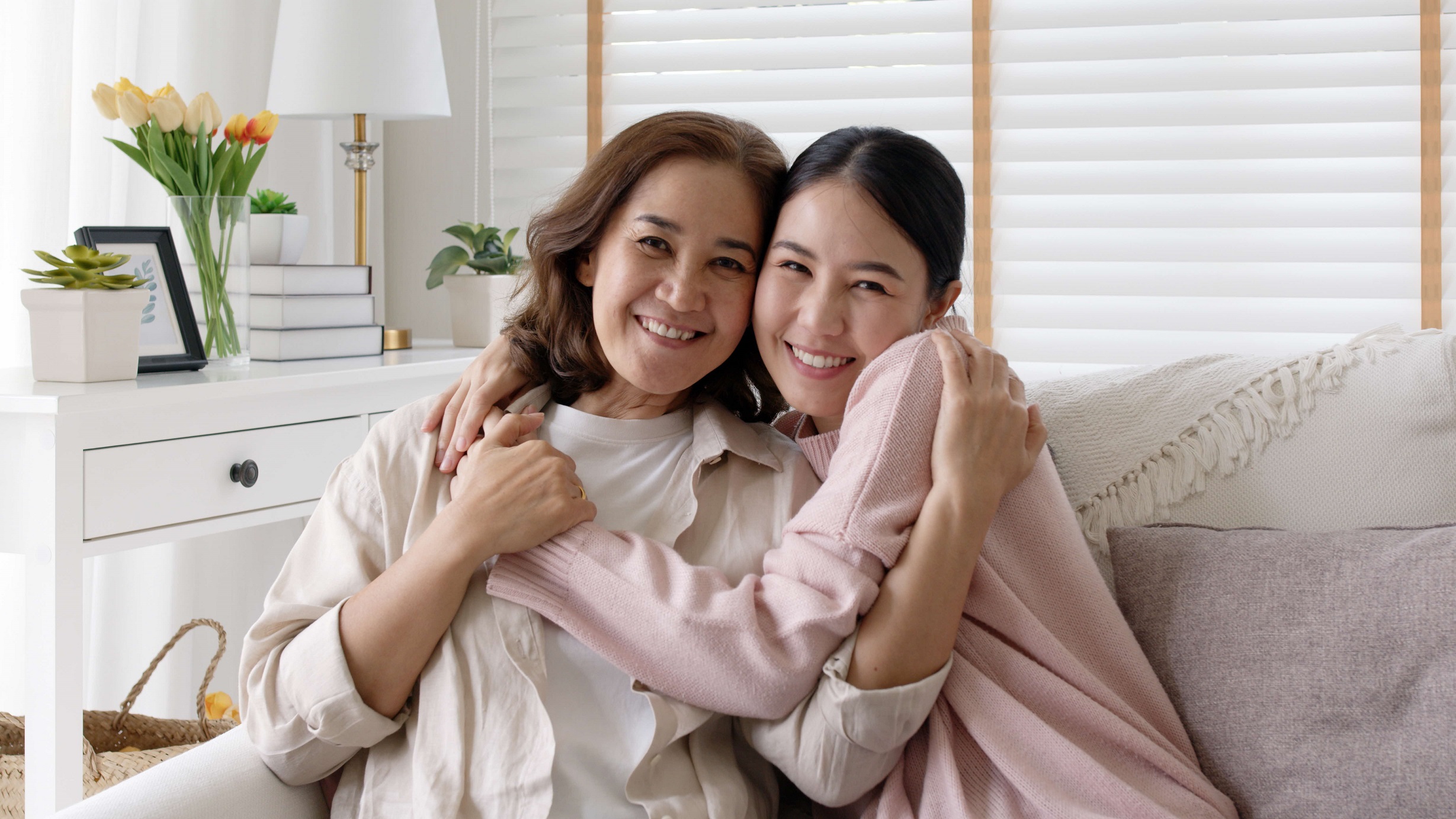 Caregiver smiling with seniors