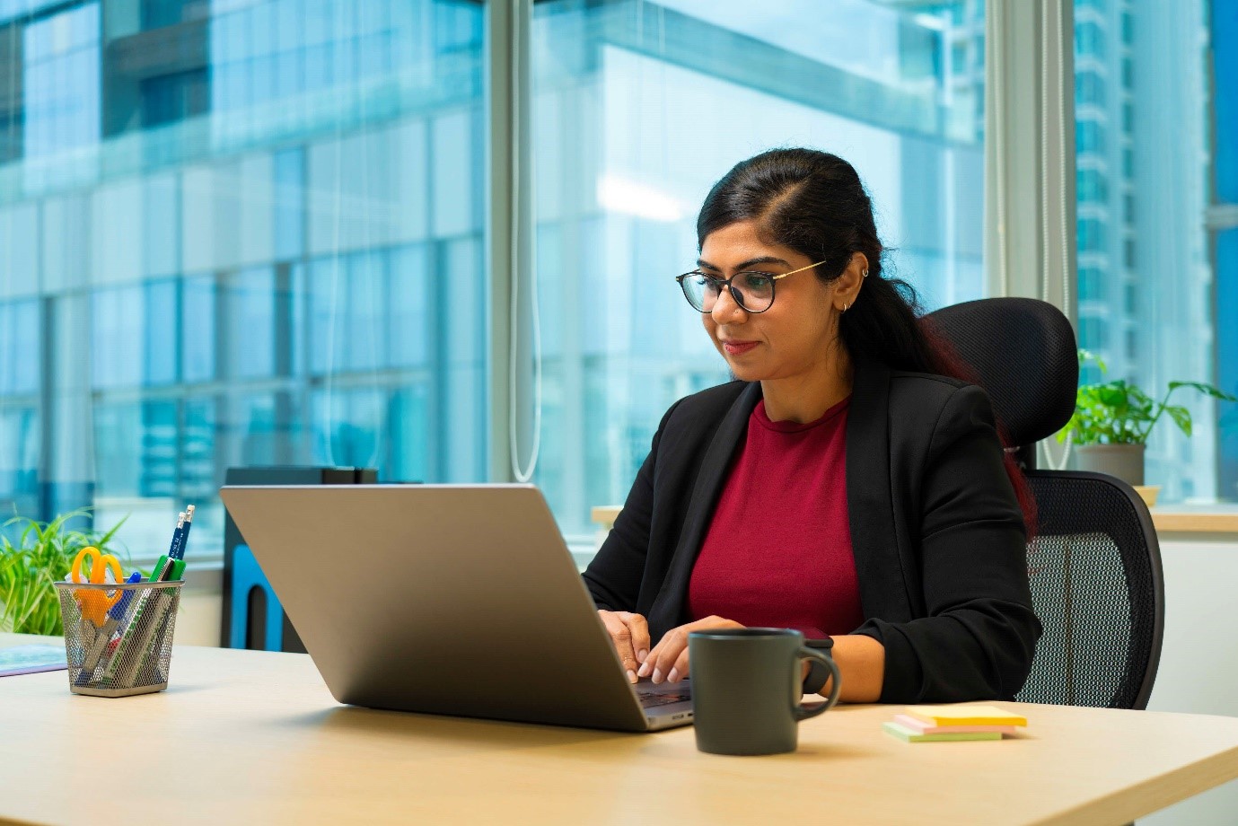 Young adult lady looking at her laptop