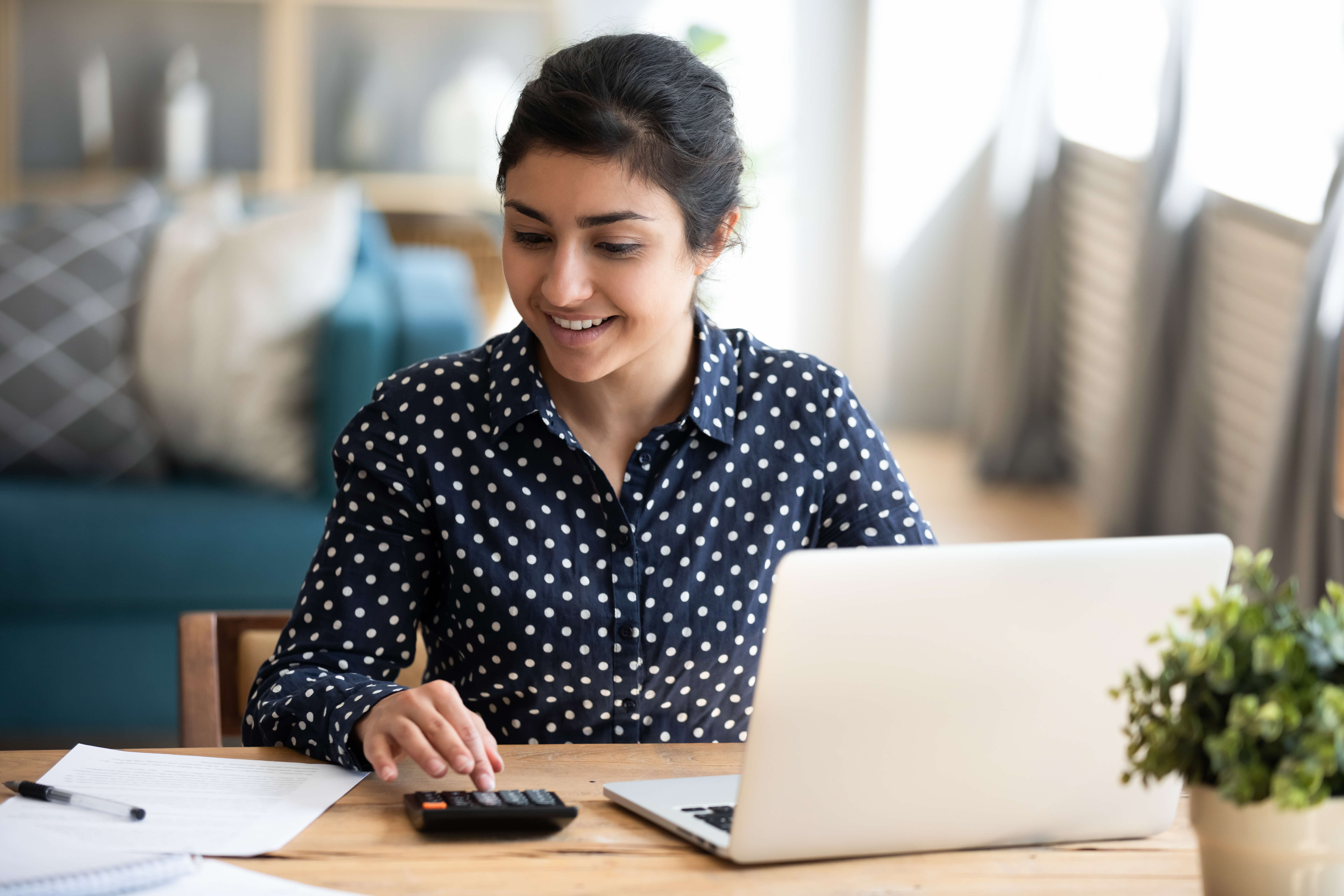 Woman calculating her finances