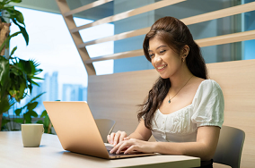 Lady looking at her laptop