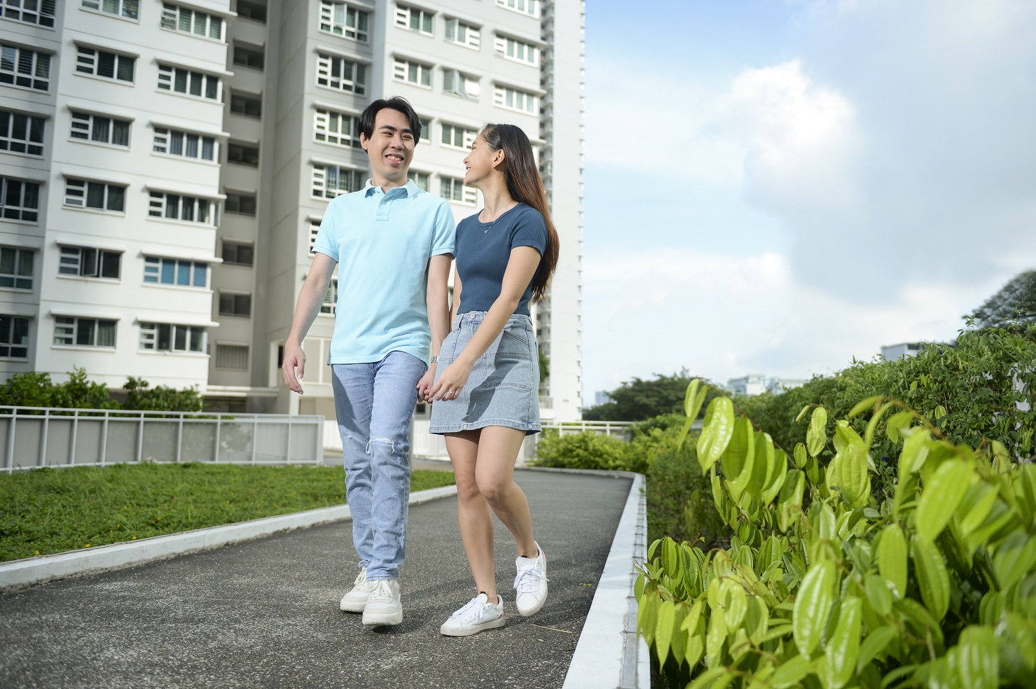 Young couple walking at their HDB estate