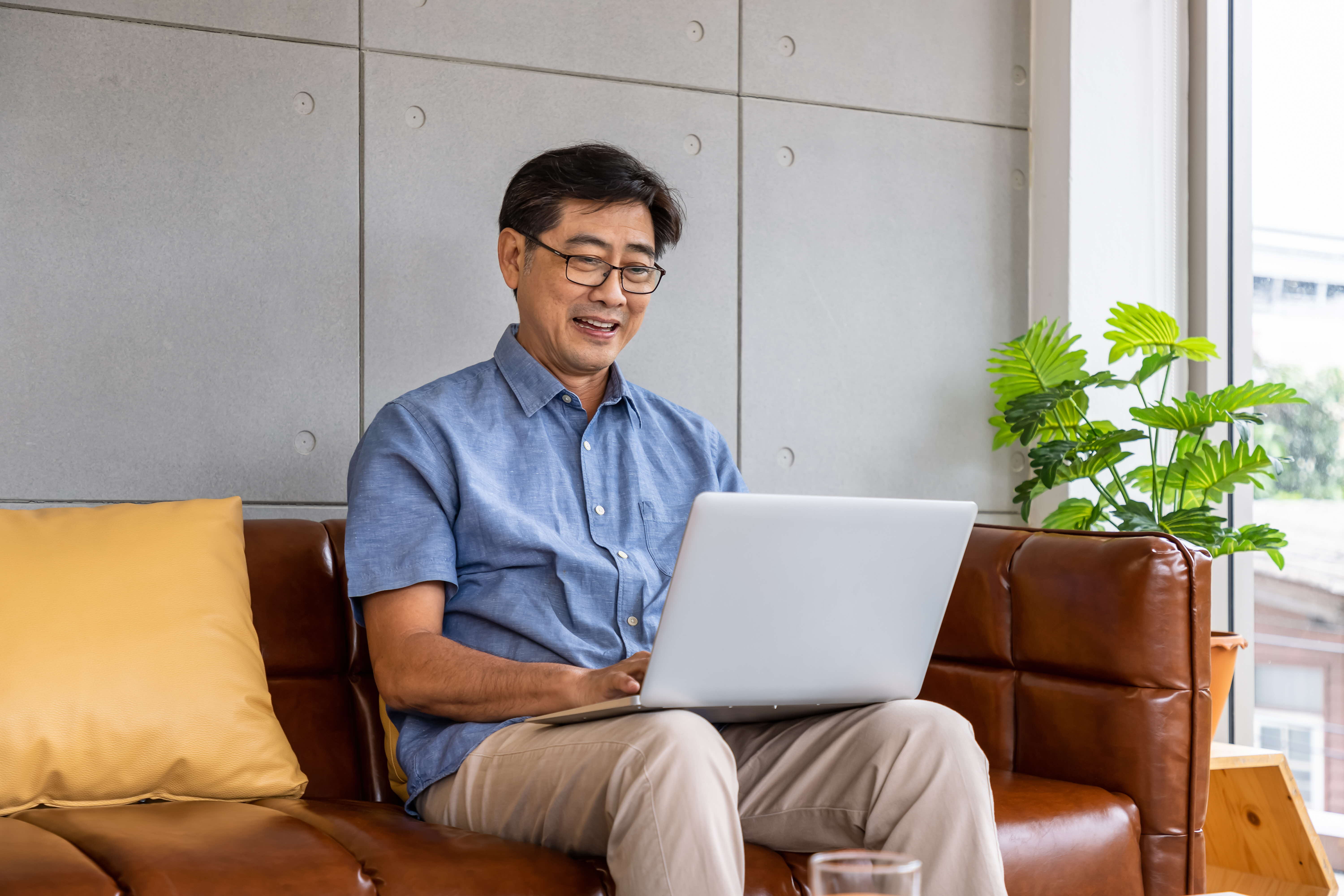 Senior worker using laptop