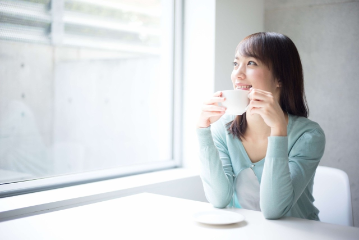 Young adult sipping on coffee