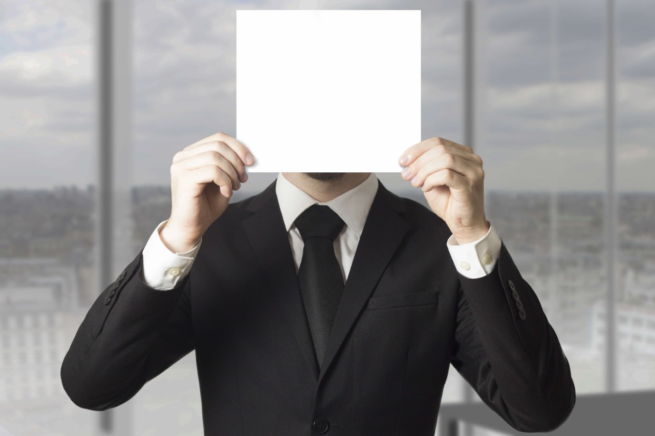 Employee with a white sheet covering his face Employee with a covered face