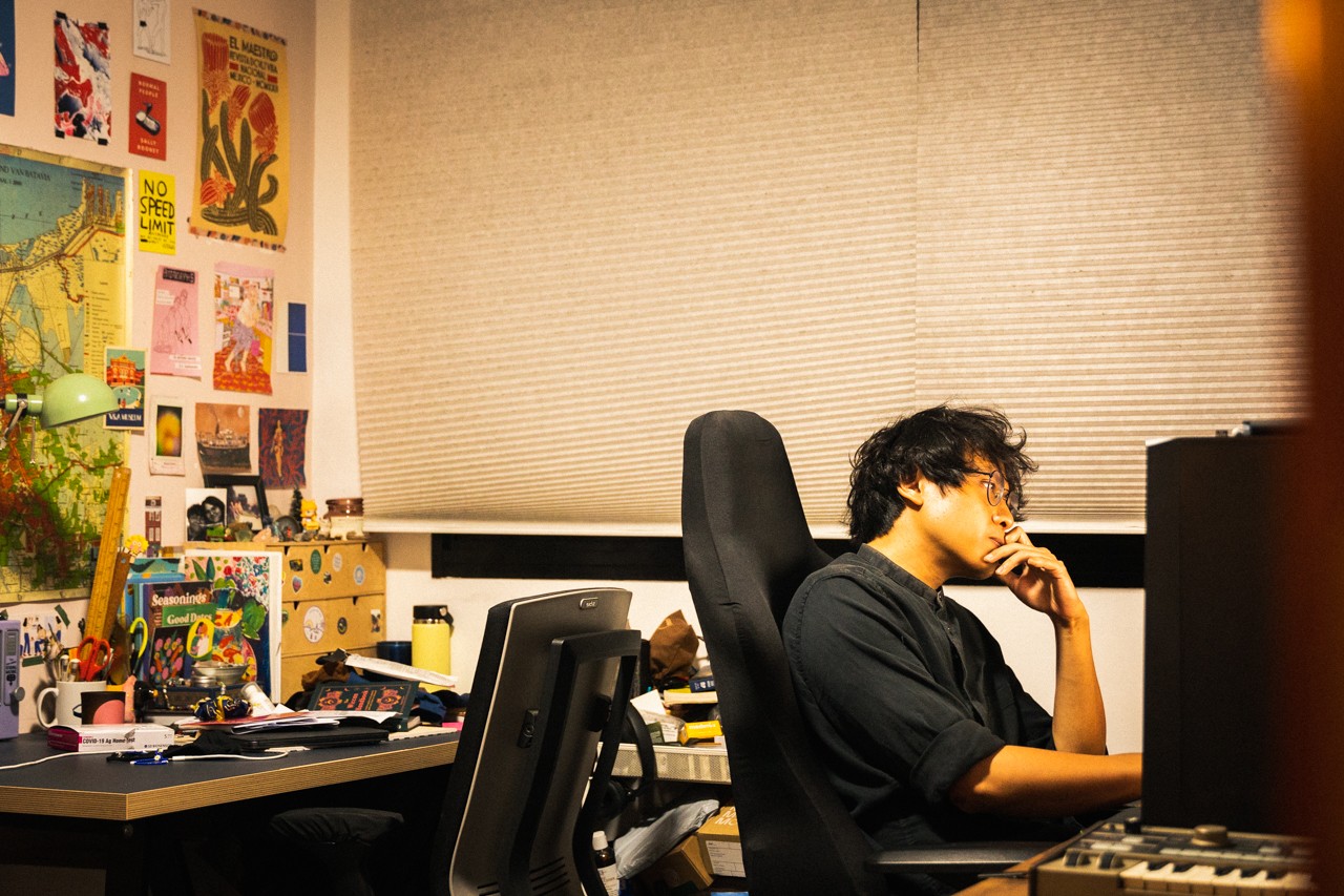 Ilyas working at his desk.